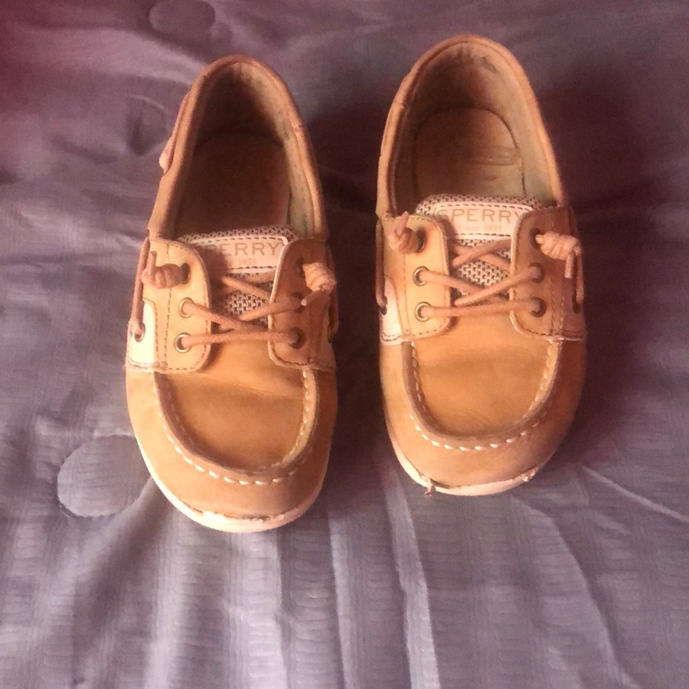 Little girls Sperry’s slid-in shoes.